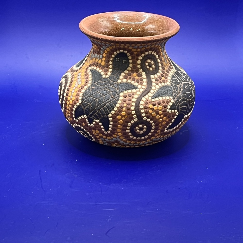 Vintage Australian aboriginal pottery vase painted Dot turtle pattern.